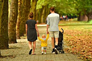 family walking in a park 